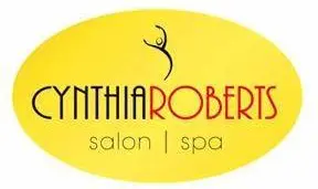 Logo of Cynthia Roberts Salon & Spa, featuring a community-based stylized person above the name in black letters on a yellow oval background.