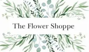 Logo of the community-based "the flower shoppe" with decorative green and blue botanical illustrations surrounding the centered, stylized text.